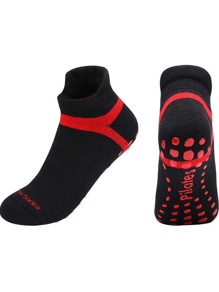 Black and red women's anti-slip compression socks for training, featuring ergonomic design and sweat-absorbing cotton fabric.